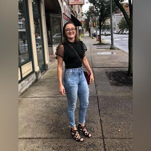 Black top with puff sleeves